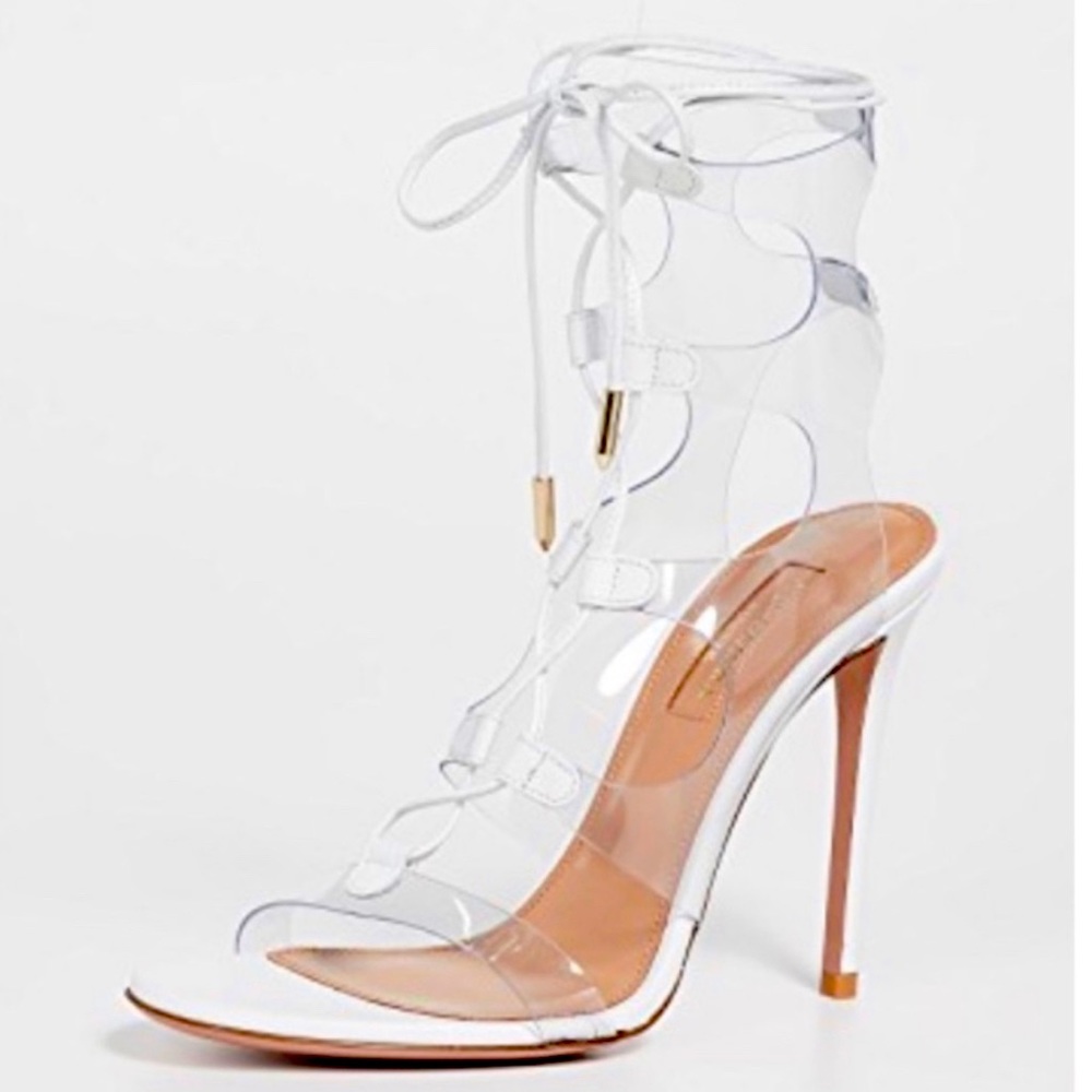 The ultimate sexy lace up sandal by Aquazzura. Clear plastic with white laces.